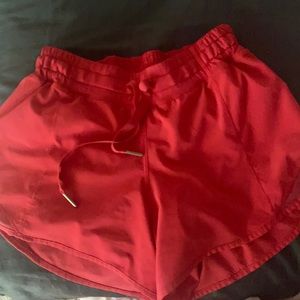 size 4 lululemon shorts/light red/never worn